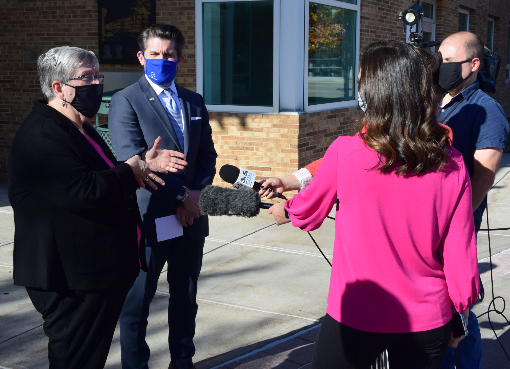 OCC President Dr. Casey Crabill (left) and SUNY Chancellor Dr. Jim Malatras (right) speak with the media outside the Whitney Applied Technology Center.